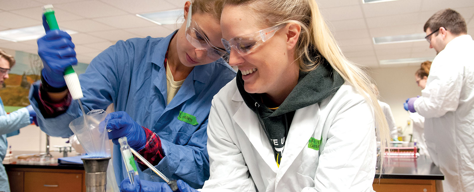 Two female students working in a lab.