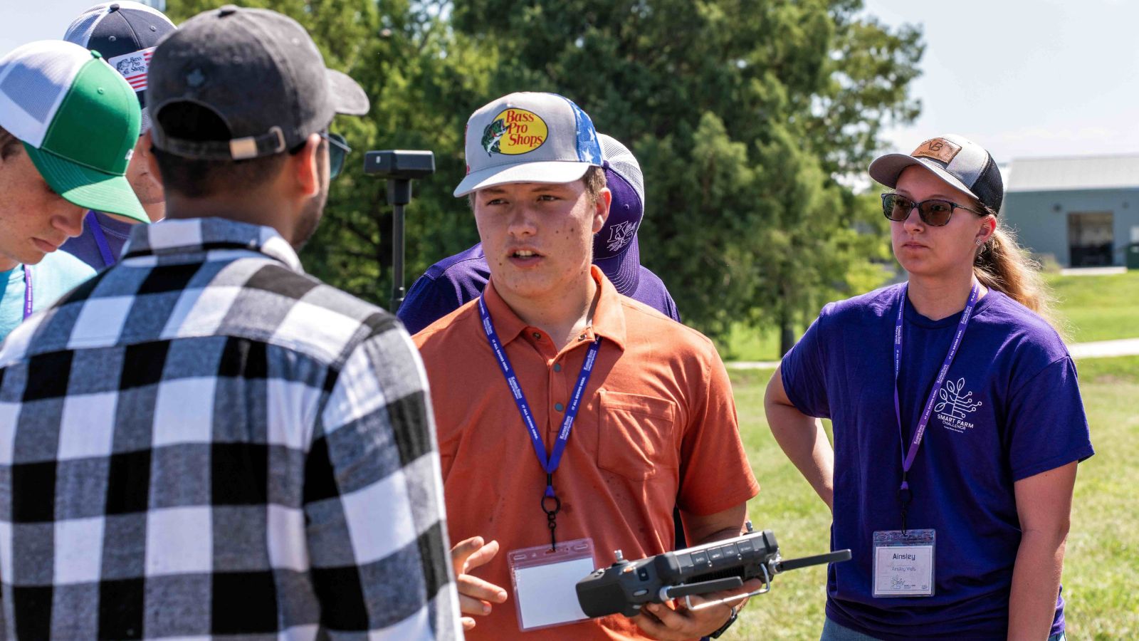 Group of students looking at drone controller