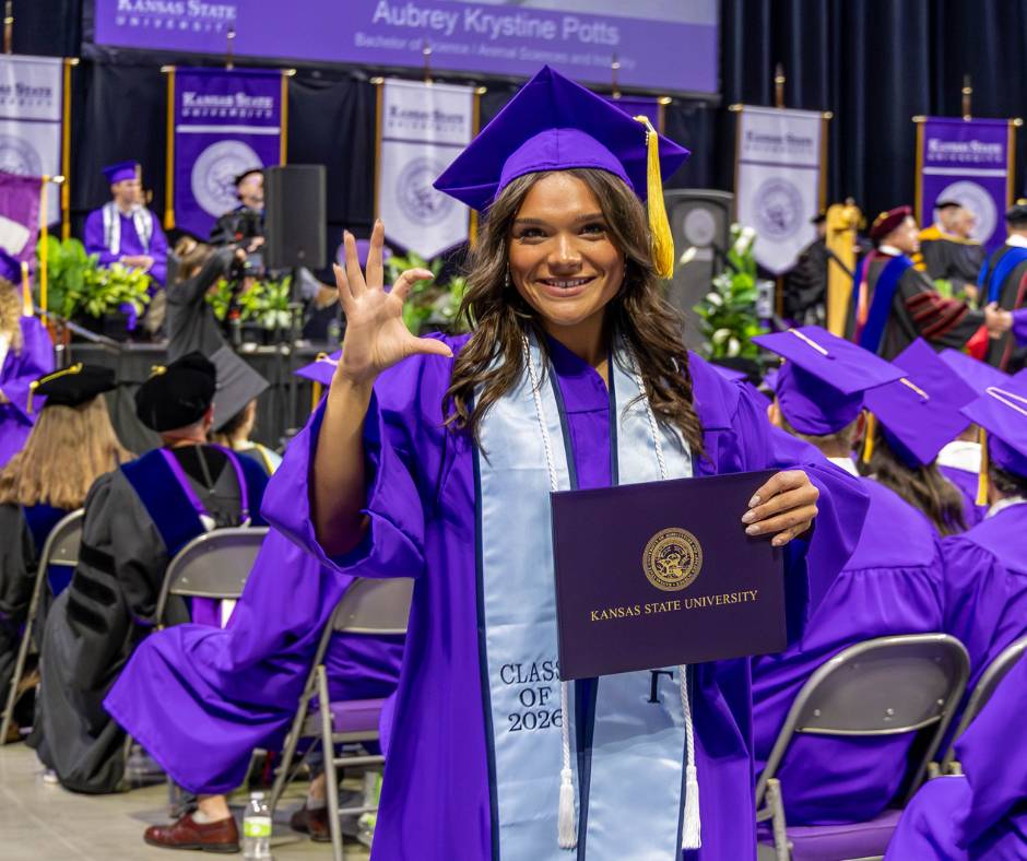 Female graduate looking at camera