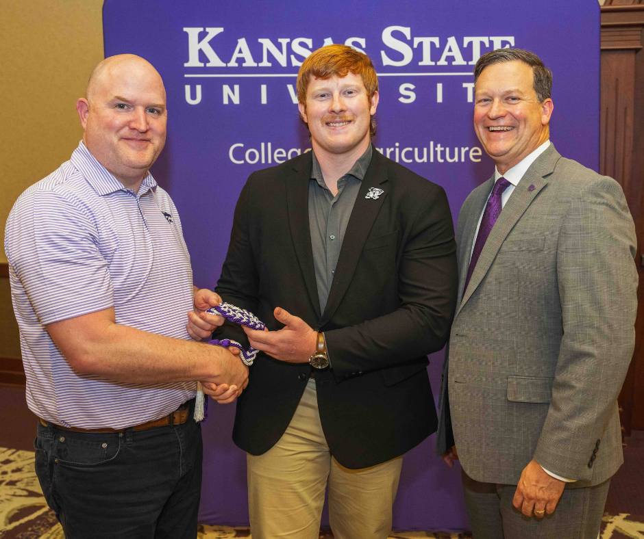 Male student receiving an award