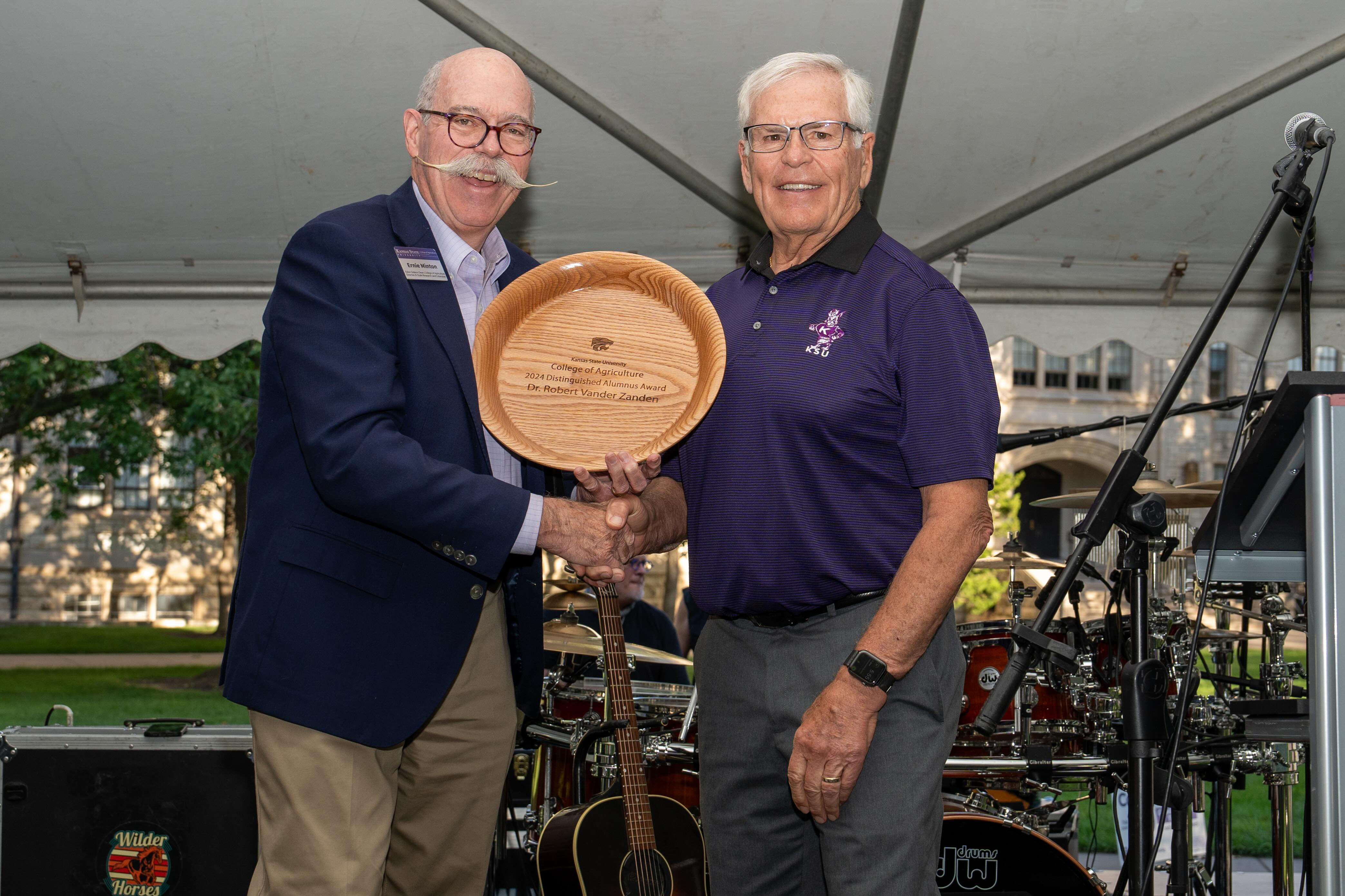 Vander Zanden recieving his 2024 alumni award