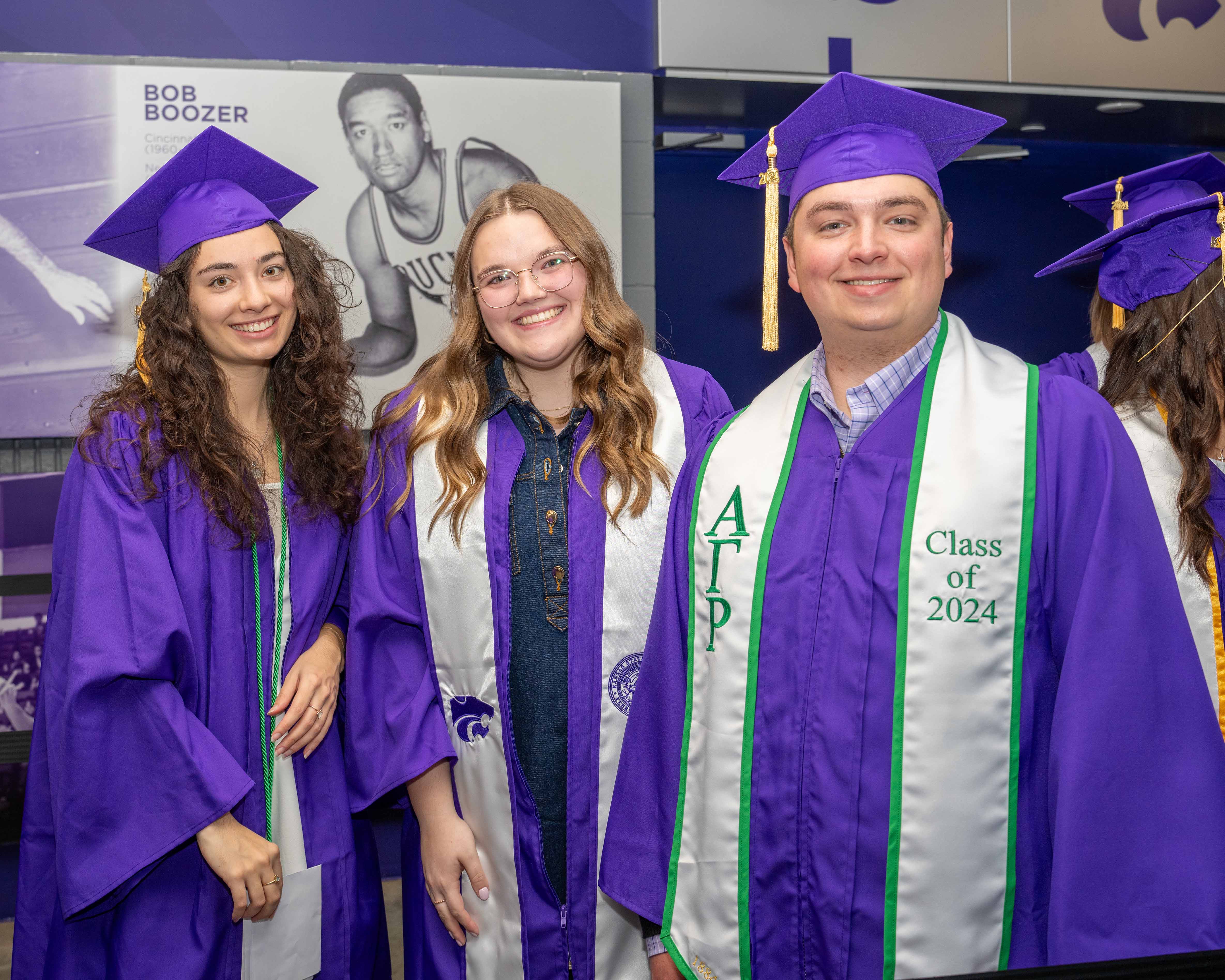 Three students posed before graduation