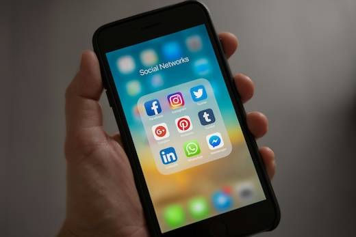 Phone showing common social media apps.